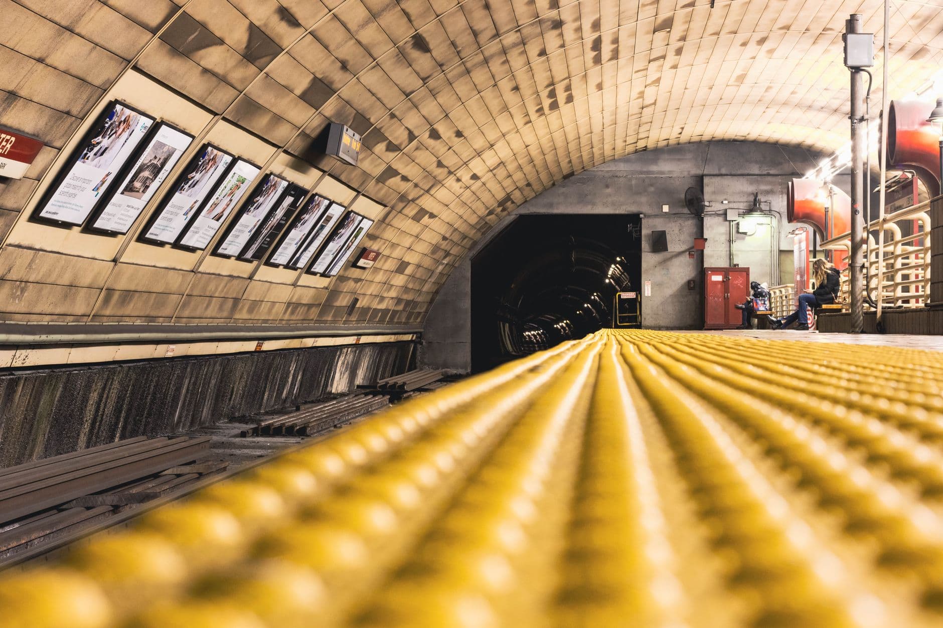 A low-angle view of an empty subway station platform in Cambridge, MA, USA.